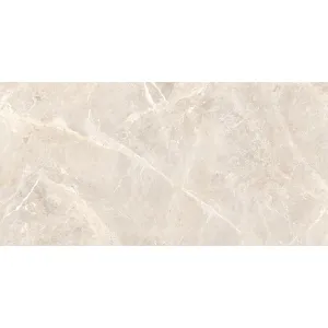GRESIE STARK CREMA 60X120 cm, cu finisaj lucios și aspect de piatră naturală. Nuanțele calde de bej și crem creează un decor armonios și luminos